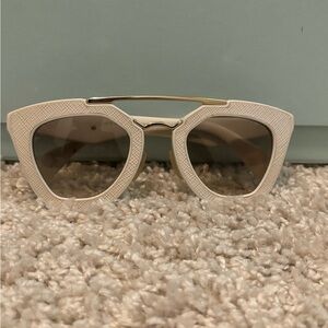 Prada cute cream glasses.